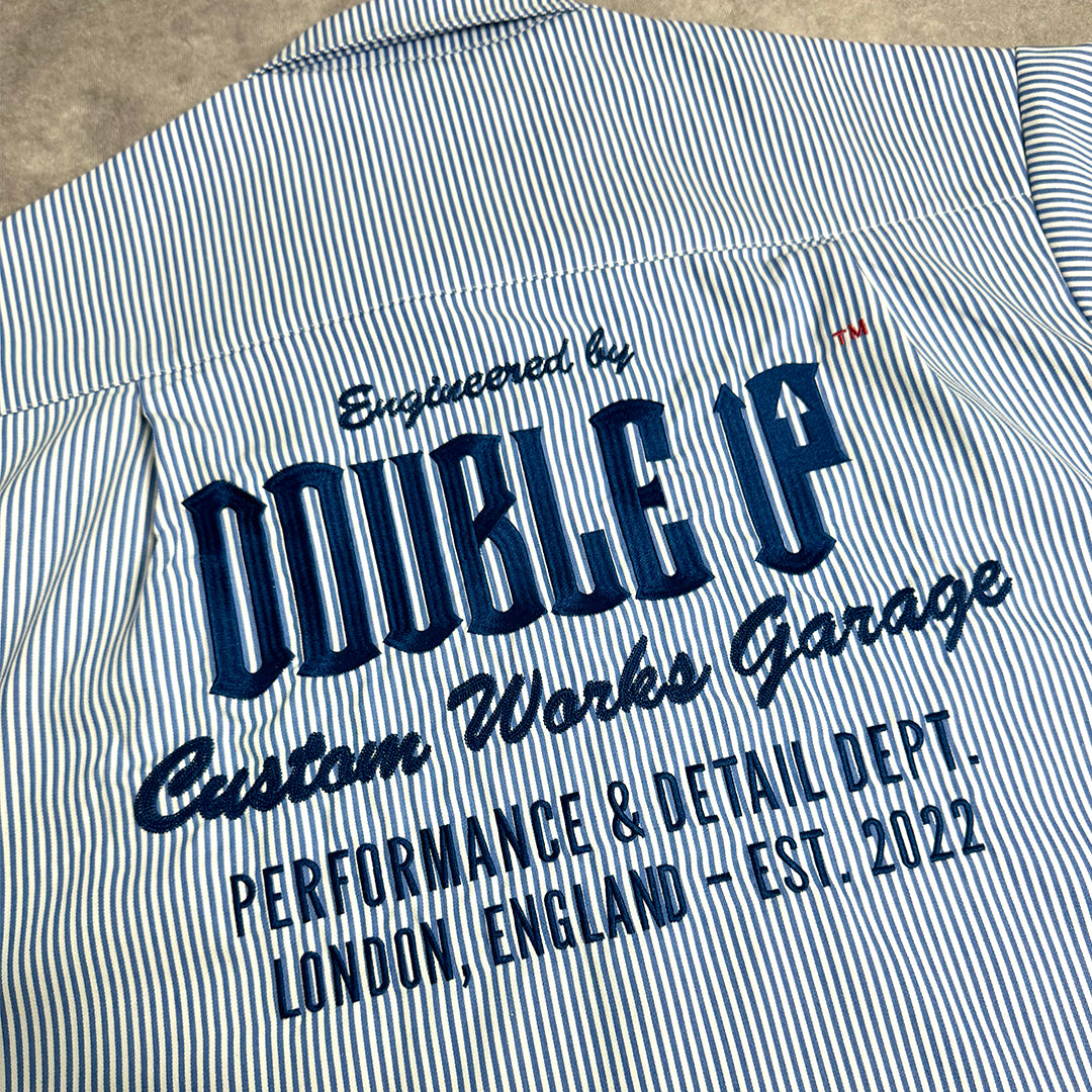 Striped shirt with 'Double UP' branding and text on a textured surface