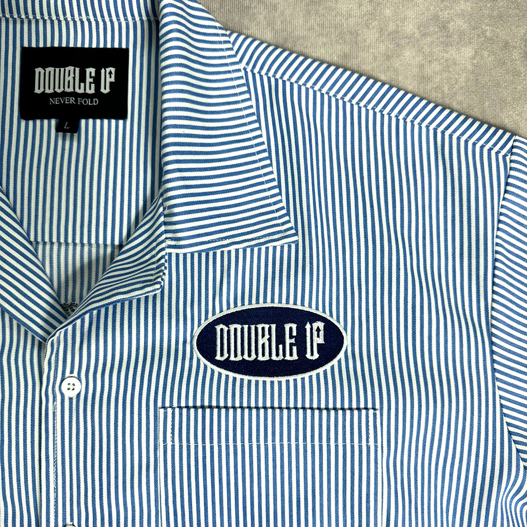 Blue and white striped shirt with 'DOUBLE UP' branding on a neutral background