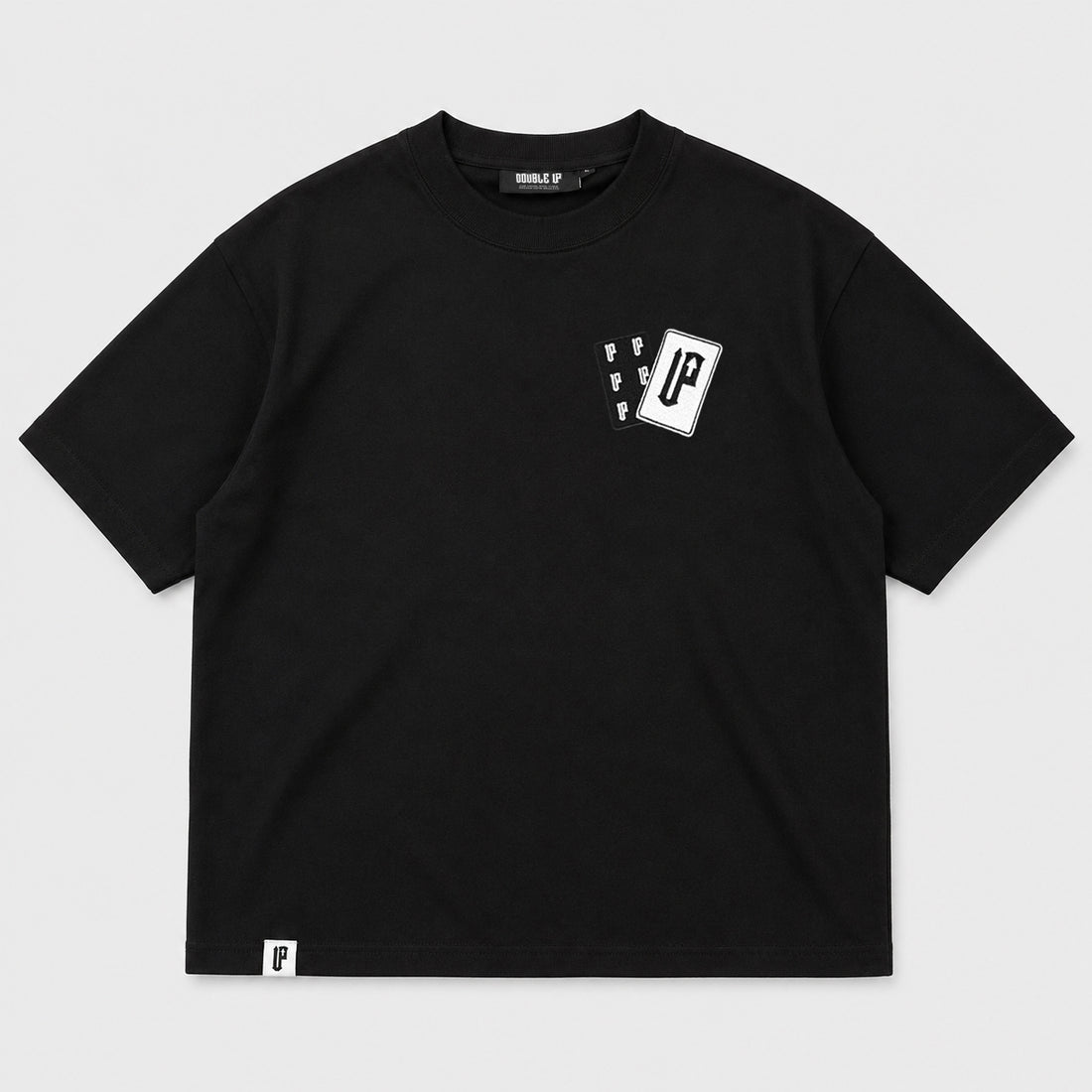 A black short-sleeve crewneck t-shirt with a small white graphic on the left chest and a small white brand tag near the bottom hem, displayed flat against a light gray background.