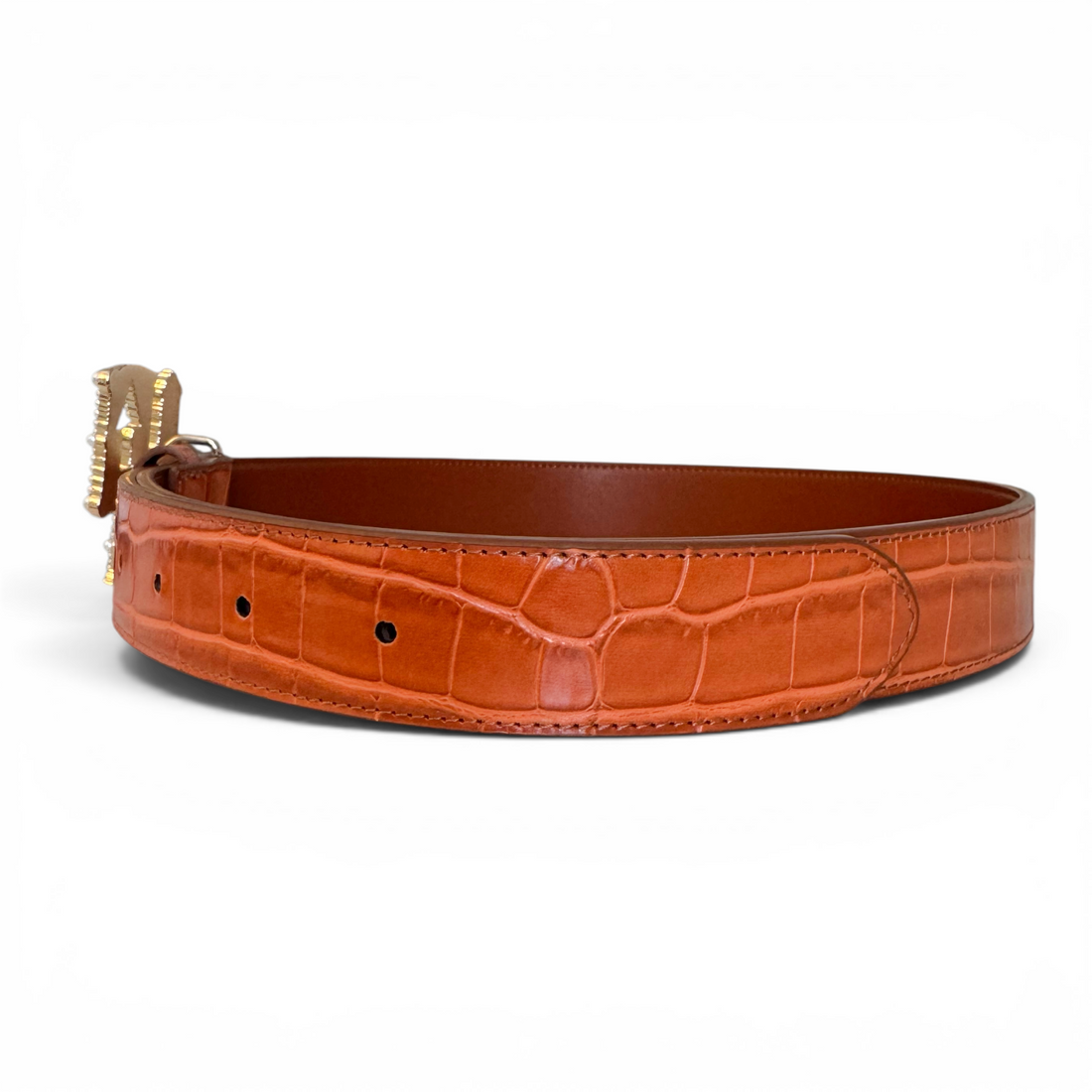 Brown Orange leather belt with gold buckle on a white background