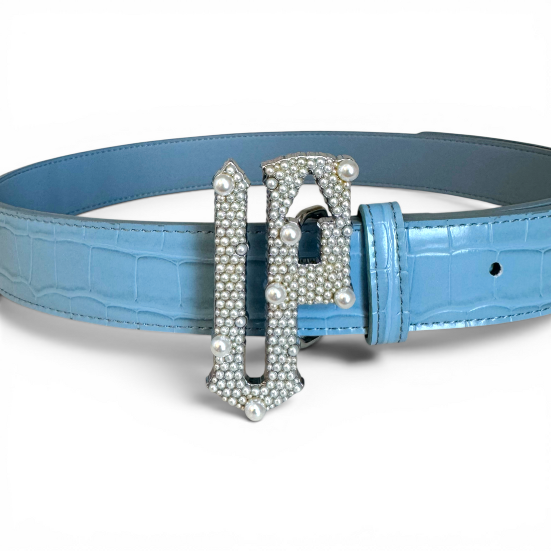 Blue belt with a decorative pearl buckle on a white background