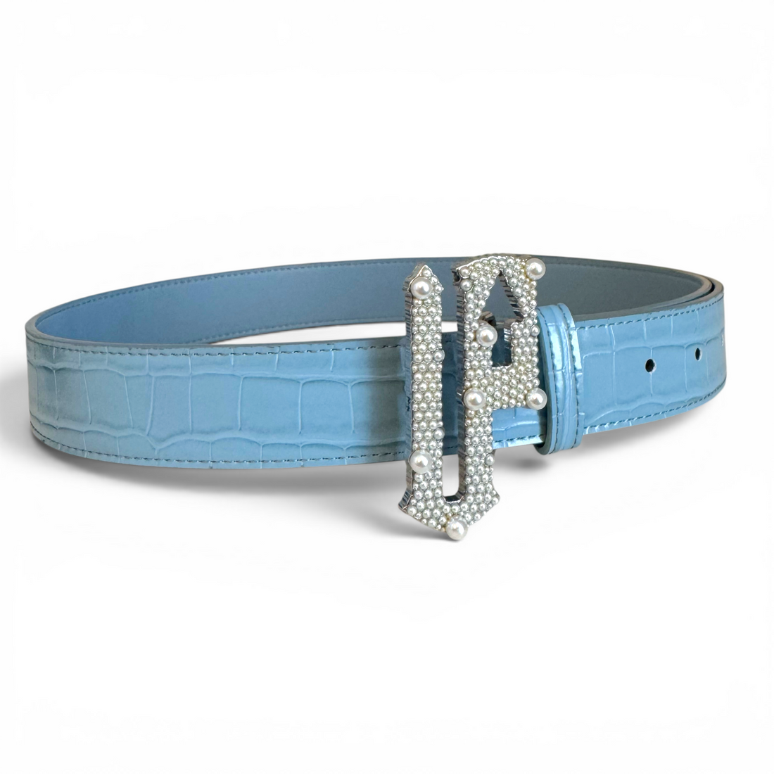 Blue belt with a decorative silver buckle on a white background
